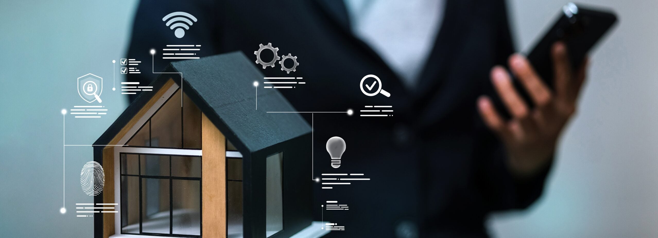 Businessman holding modern house model with smart home security and IoT control icons while using smartphone. C